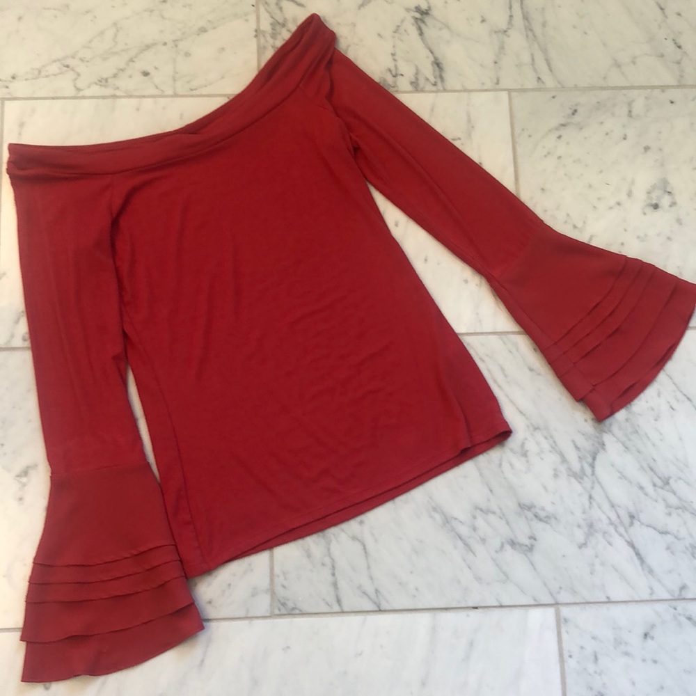 White House Black market burnt orange slightly off the shoulder bell sleeve top.